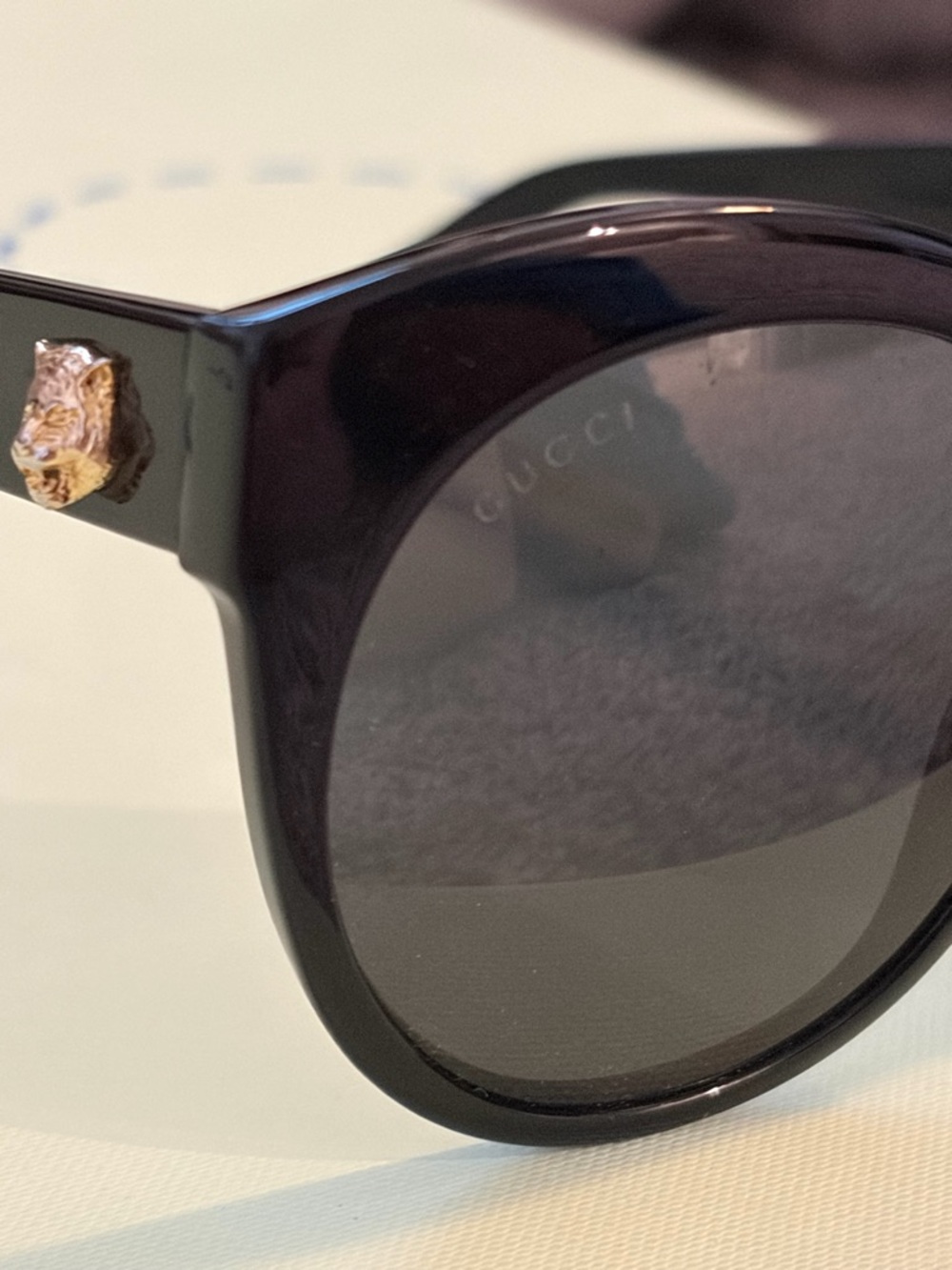Gucci Black Round Sunglasses with Gold GG Accent